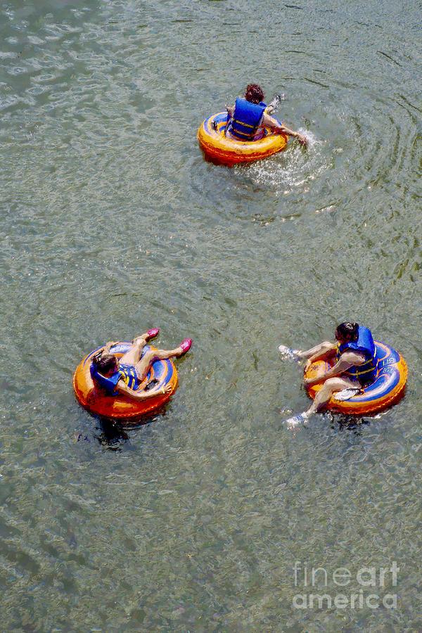 Three women tubing down the Potomac River at Harpers Ferry, West Virginia USA Photograph by William Kuta