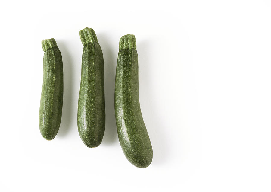 Three zucchini, full length Photograph by Isabelle Rozenbaum