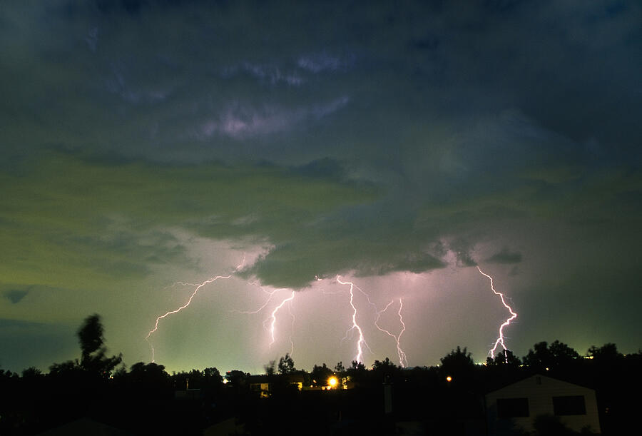 Thunderhead lightning bolts strikes over Denver Colorado neighborhood homes Photograph by Milehightraveler