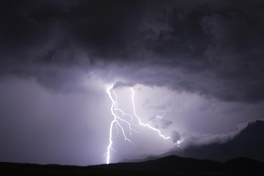 Thunderstorm sky with lightning bolts over the Drakensberg mountains. Drakensberg, South Africa Photograph by Martin Harvey