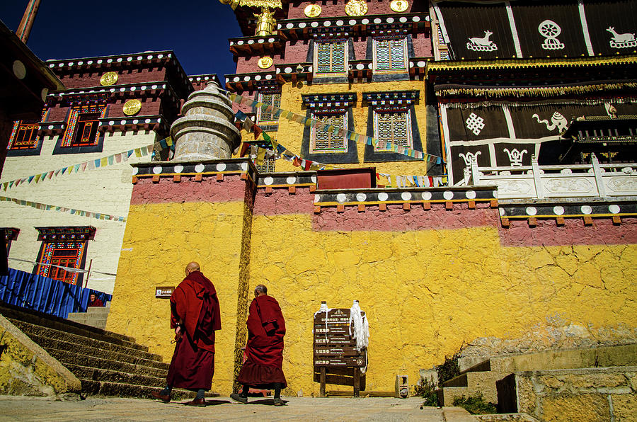 Tibetan monks walking in front of the monastery. Photograph by Adelaide Lin