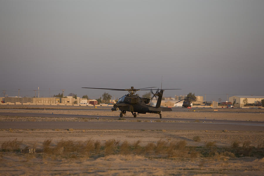 Tikrit, Iraq - An AH-64 Apache waits for clearance from the flight tower on Camp Speicher. Photograph by Stocktrek Images