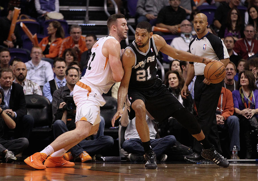Tim Duncan and Miles Plumlee Photograph by Christian Petersen