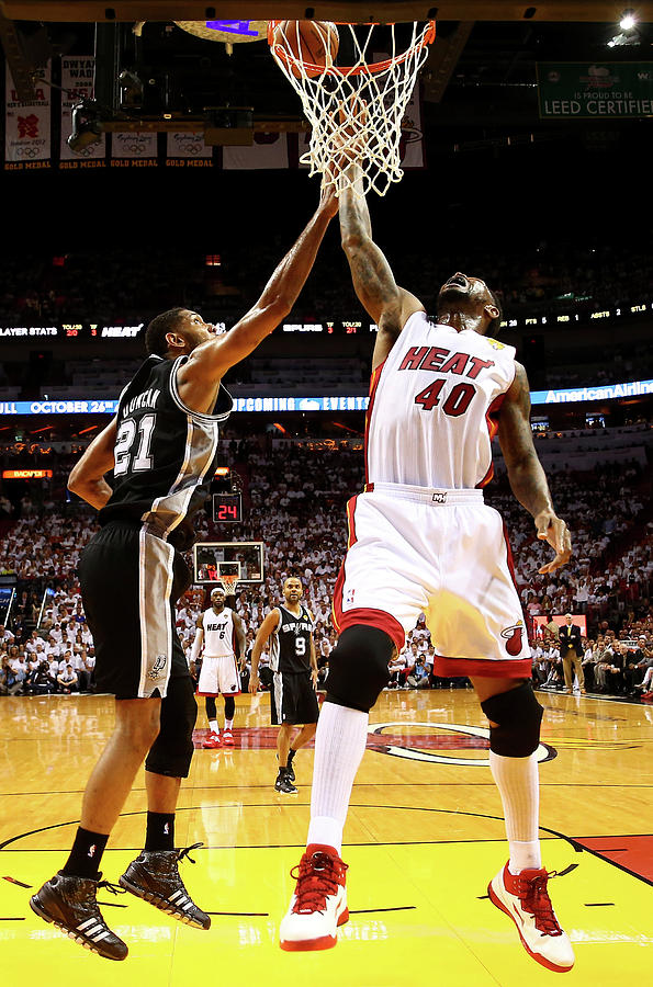 Tim Duncan and Udonis Haslem Photograph by Andy Lyons