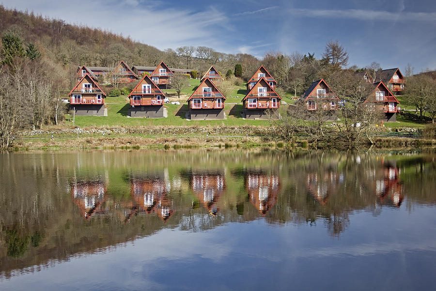 Timber Holiday Lodges By a Lake Photograph by Creativenaturemedia