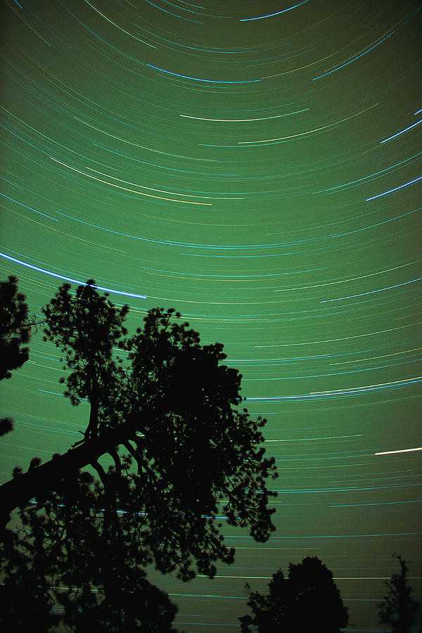 Time-lapse shot of stars in sky Photograph by Stockbyte