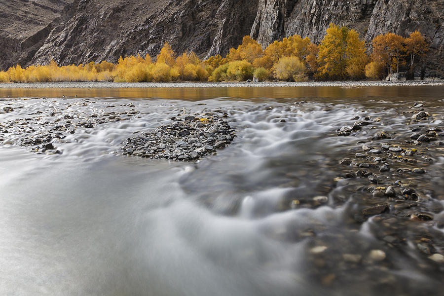 Time lapse view of river and rocky riverbed in remote landscape Photograph by Jeremy Woodhouse
