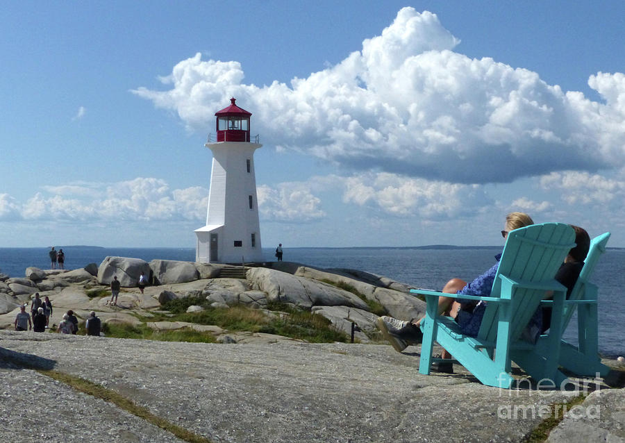 Time to relax at Peggys Cove Lighthouse, Nova Scotia Photograph by Phil Banks