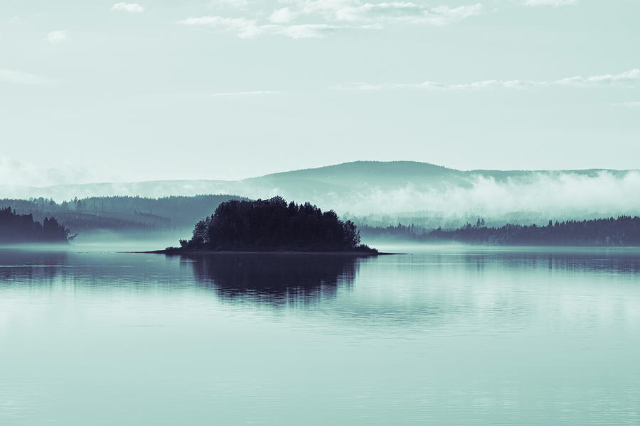 Tiny island with rising wisps of morning haze - duotone blue Photograph by Ulrich Kunst And Bettina Scheidulin