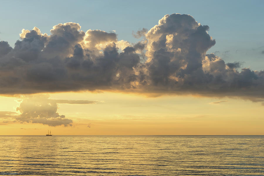 Tiny Tall Ship - Golden Horizon Motorsailing Under Dramatic Clouds Photograph
