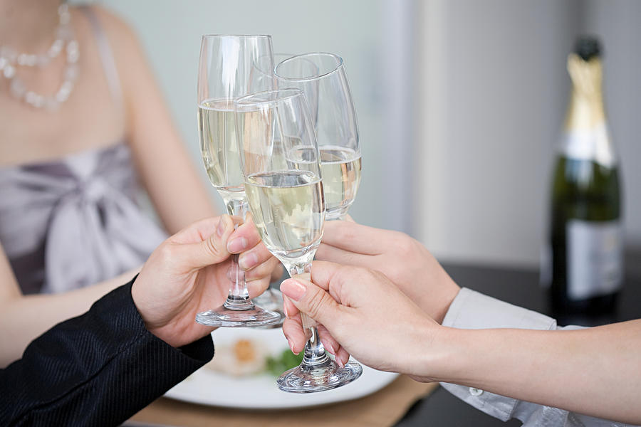 Toasting with champagne Photograph by Image Source