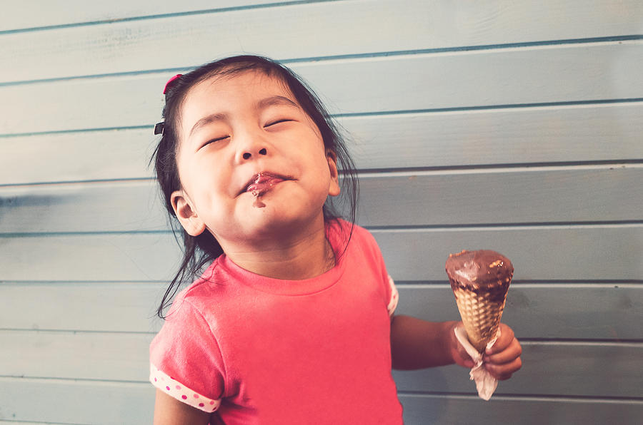 Toddler enjoying her ice-creme Photograph by Kinson C Photography