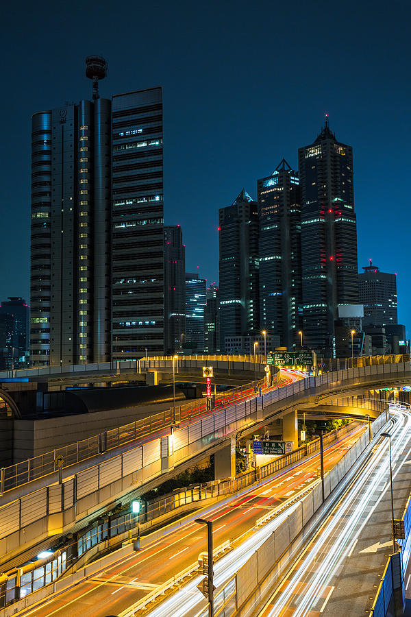 Tokyo Highway with Park Hyatt Hotel at night Photograph by Sandro Bisaro