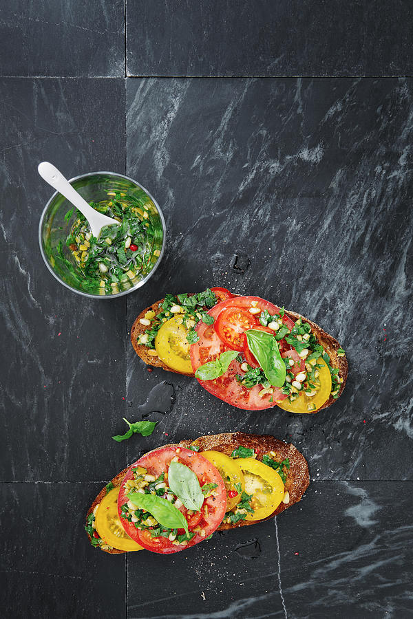 Tomato, harissa and green olive bruschetta Photograph by Eugene Mymrin