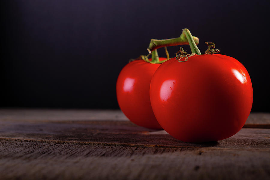 Tomatoes on a Wooden Table Photograph by Vincent Billotto