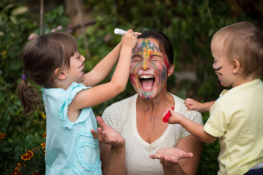 Too much creativity - children painting mothers face Photograph by Martin Novak