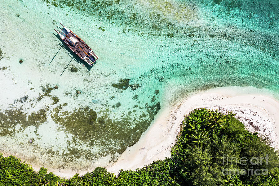 Top down view of a sailboat in the Muri lagoon in the Rarotonga  Photograph by Didier Marti