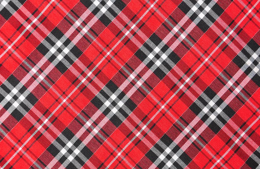 Top View Of Tartan Cloth Pattern On The Table In Restaurant Photograph