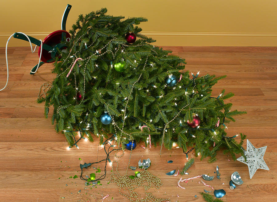 Toppled over Christmas tree with decorations and lights Photograph by Jeffrey Coolidge