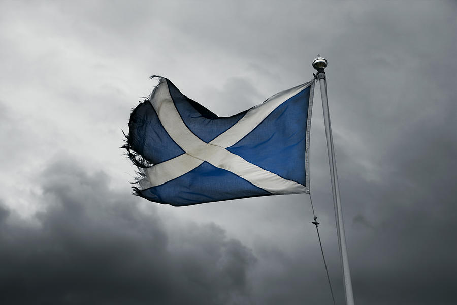 Torn Scottish Flag In The Storm Photograph by Philartphace
