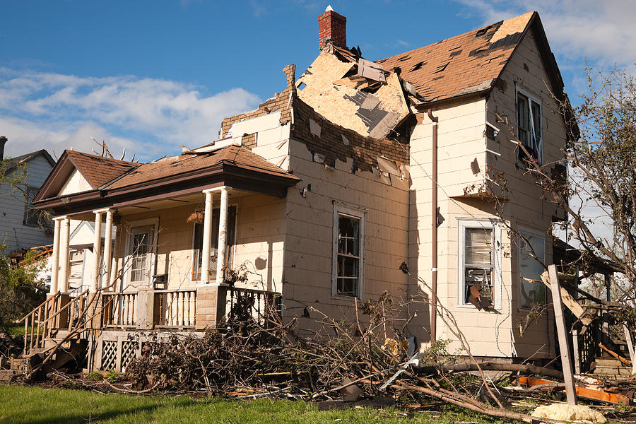 Tornado battered home severely damaged. Photograph by Jimkruger