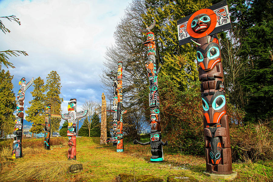 Totem Poles Photograph by Dale R Carlson