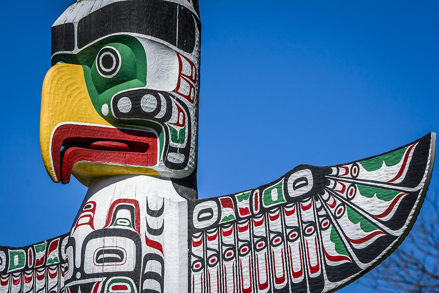 Totem poles in Stanley park, Vancouver. Photograph by VisualCommunications