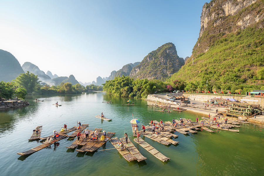 Tourist bamboo rafts in Yangshuo Guilin Photograph by Philippe Lejeanvre