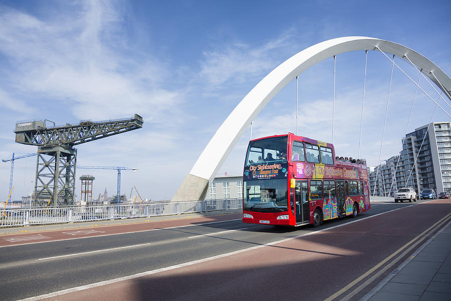 Tourist bus crossing the Squinty Bridge, Glasgow Photograph by Theasis