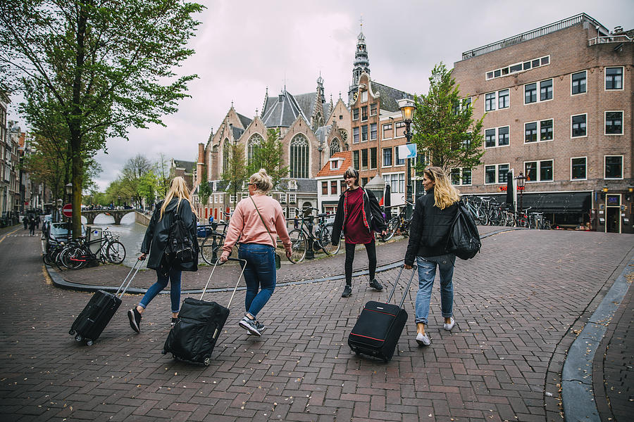 Tourists Arriving in Amsterdam Photograph by SolStock