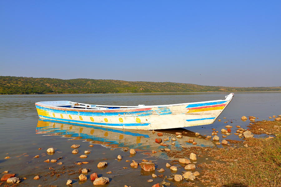 Tourists boat in the lake Photograph by Amir Mukhtar