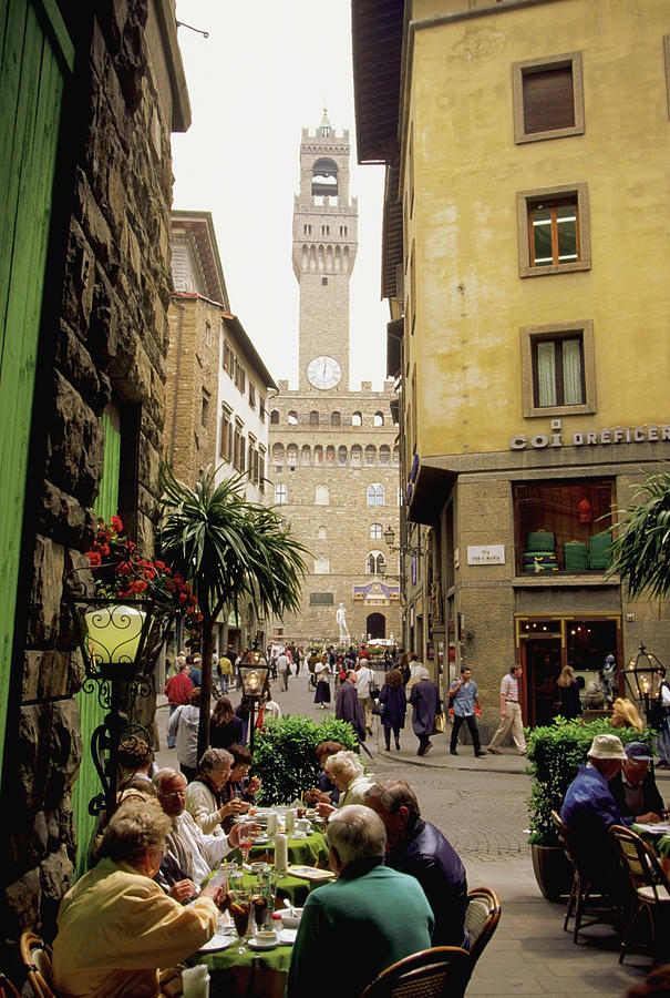Tourists eating at sidewalk cafe, Palazzo Vecchio, Florence, Italy Photograph by Medioimages/Photodisc