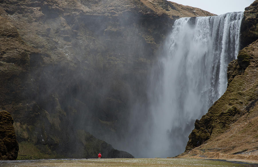 Tourists enjoying the Skogafoss waterfall and river in Iceland Photograph by Michalakis Ppalis