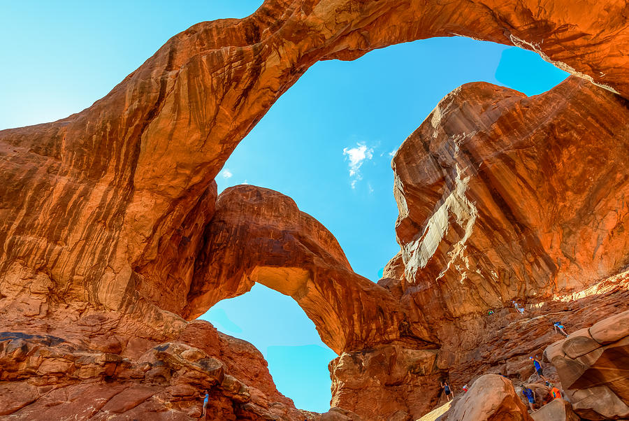 Tourists Explore Double Arch, Arches National Park, Moab Utah Photograph by Greg Jaggears