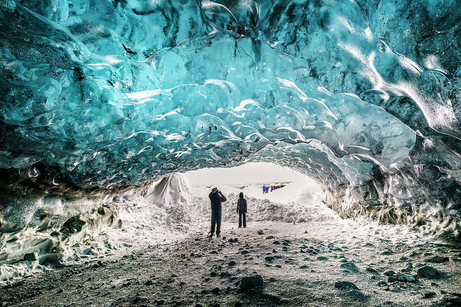 Tourists in The Crystal Cave, Breidamerkurjokull Glacier, Iceland Photograph by Arctic-Images