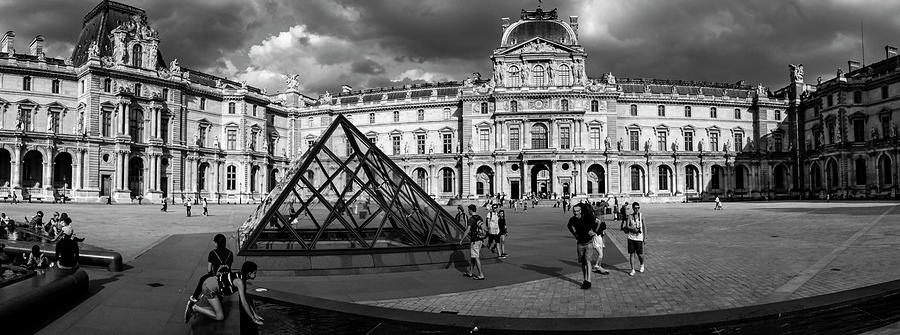 Tourists near a glass pyramid at Musee Du Louvre, Paris, Ile-de-France, France Photograph by Panoramic Images