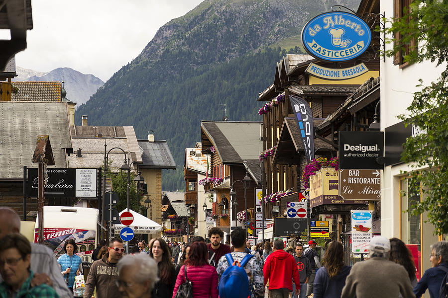 Tourists shopping on streets of duty-free area in Livigno, Italy Photograph by Josefkubes