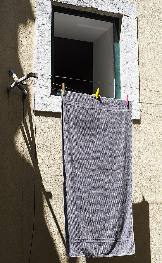 Towel drying in the sun in inner city Lisbon Photograph by Lyn Holly Coorg