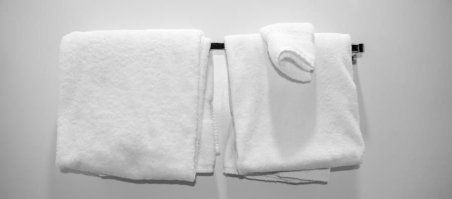 Towels in a Motel Room Photograph by Thomas Winz
