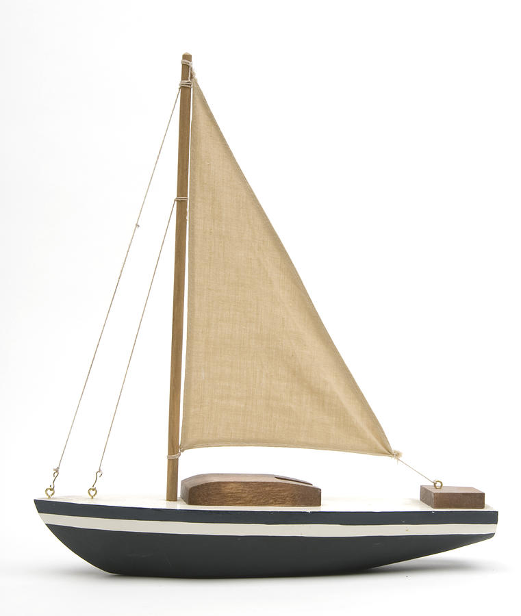 Toy boat with a large brown sail Photograph by GaryAlvis