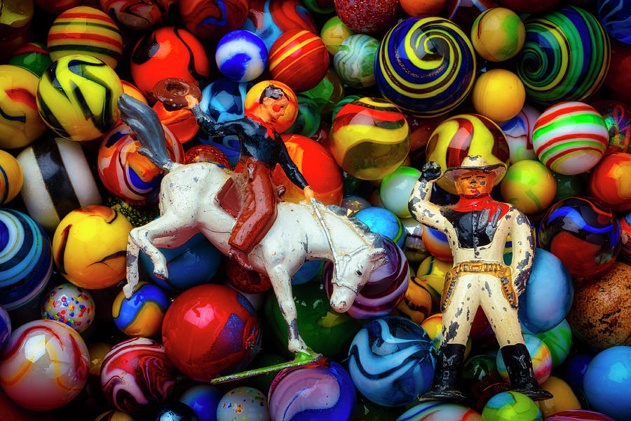 Toy Cowboys And Marbles Photograph by Garry Gay