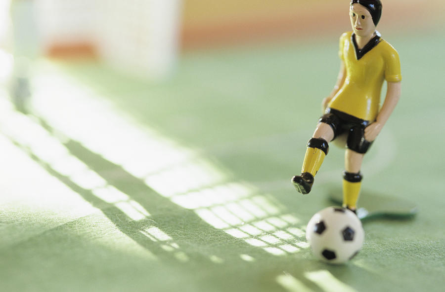 Toy figurine playing football, Tipp Kick Photograph by Achim Sass