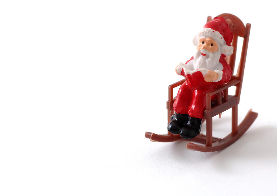 Toy Santa Claus in rocking chair Photograph by Laurence Mouton