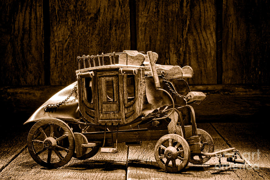 Toy Stagecoach - Sepia Photograph by Olivier Le Queinec