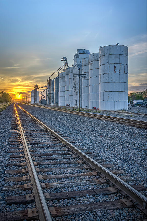 Tracks to Sunset in Nebraska Photograph by Laura Hedien