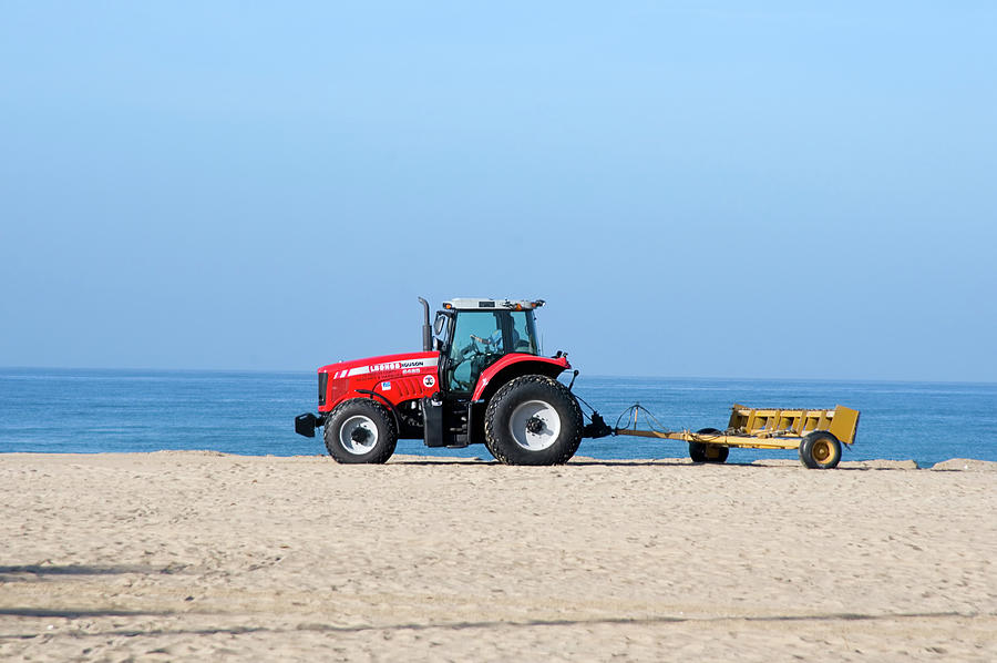 Tractor Cleaning the Sand on the Beach Photograph by Mark Stout