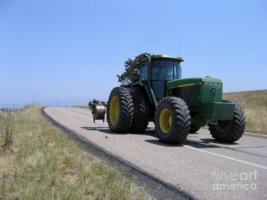 Tractor On An Offramp Photograph by James B Toy