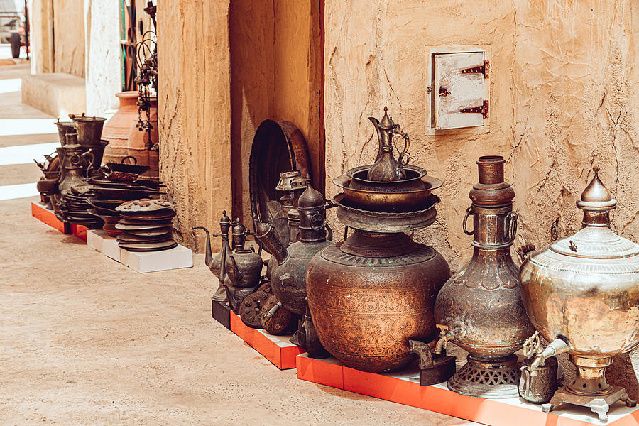 Traditional Arab copper utensils for sale in Dubai Photograph by Kolderal