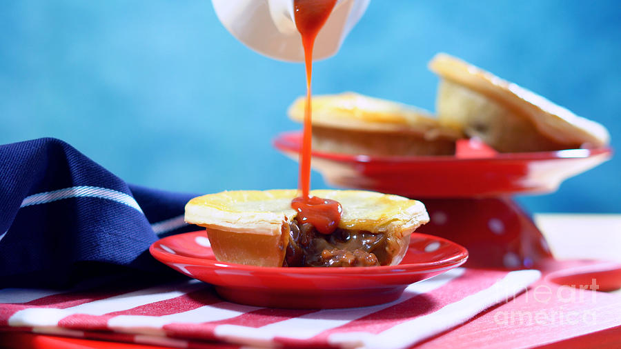 Traditional Australian Meat Pies and Tomato Sauce. Photograph by Milleflore Images