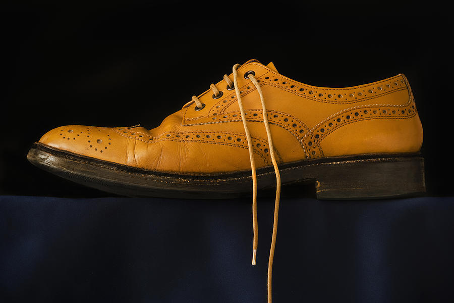 Traditional brogue on black background Photograph by Joe Clark